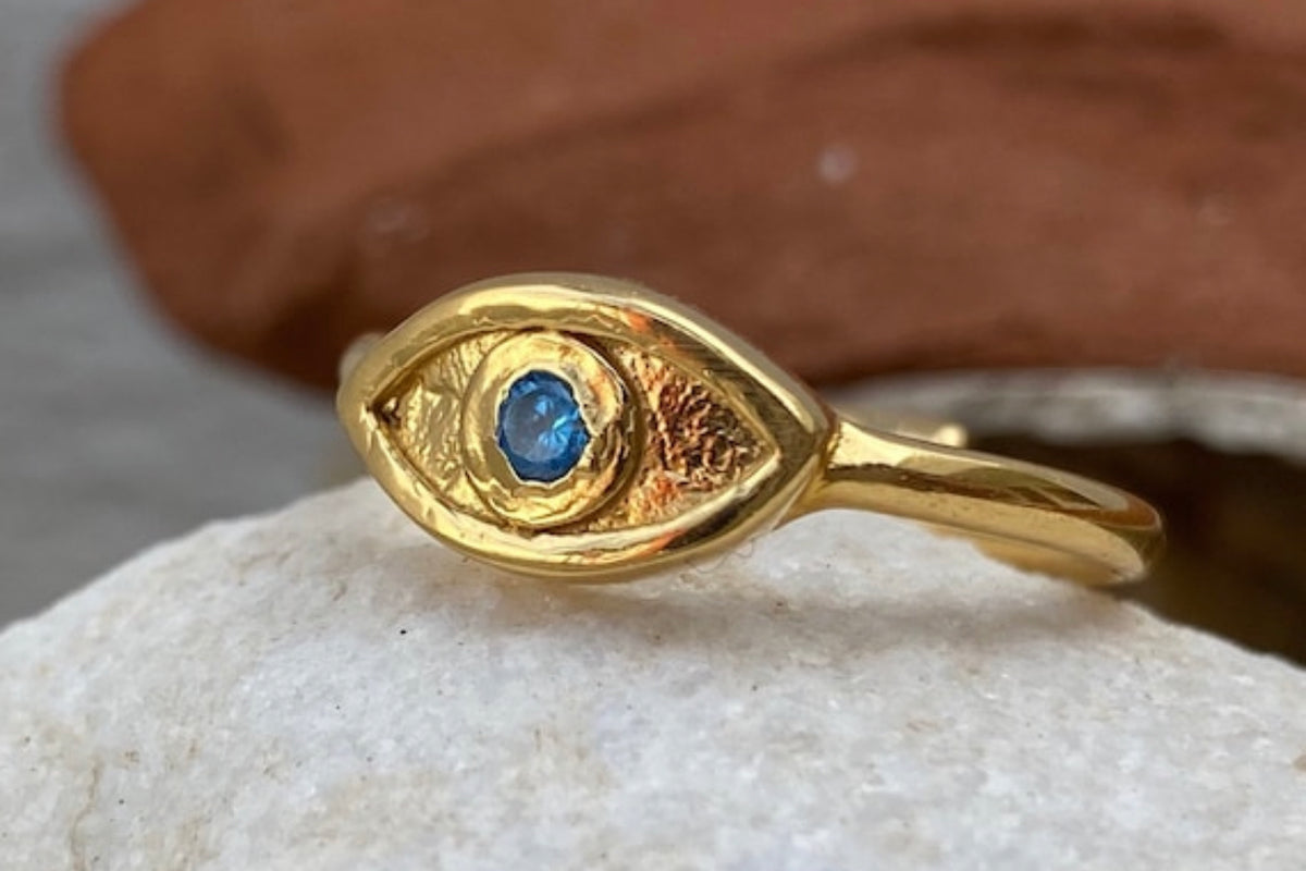evils eye ring gold with blue gemstone