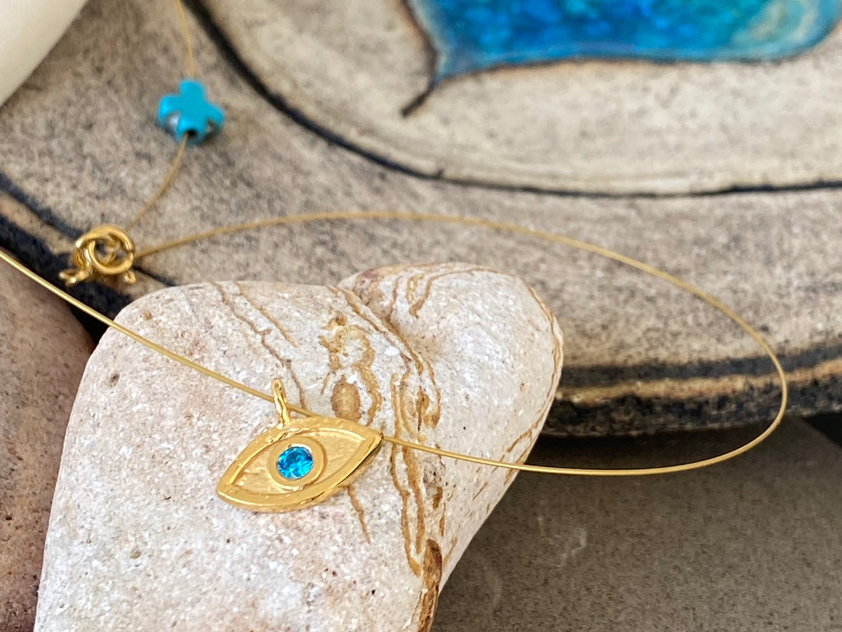 evil eye necklace gold with blue gem