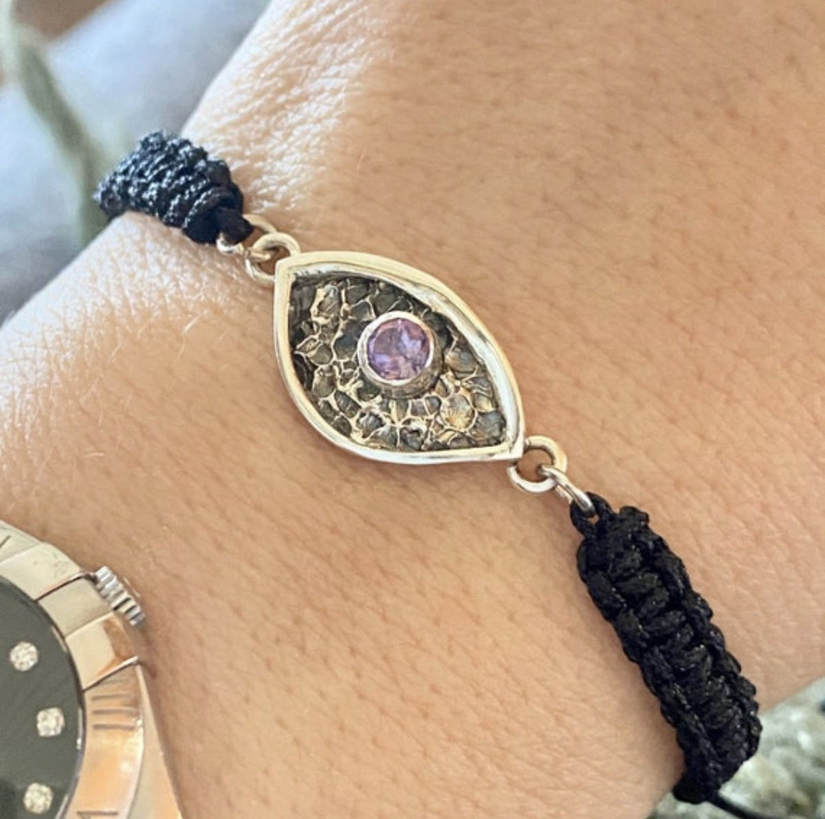 silver and purple gemstone bracelet with black macrame