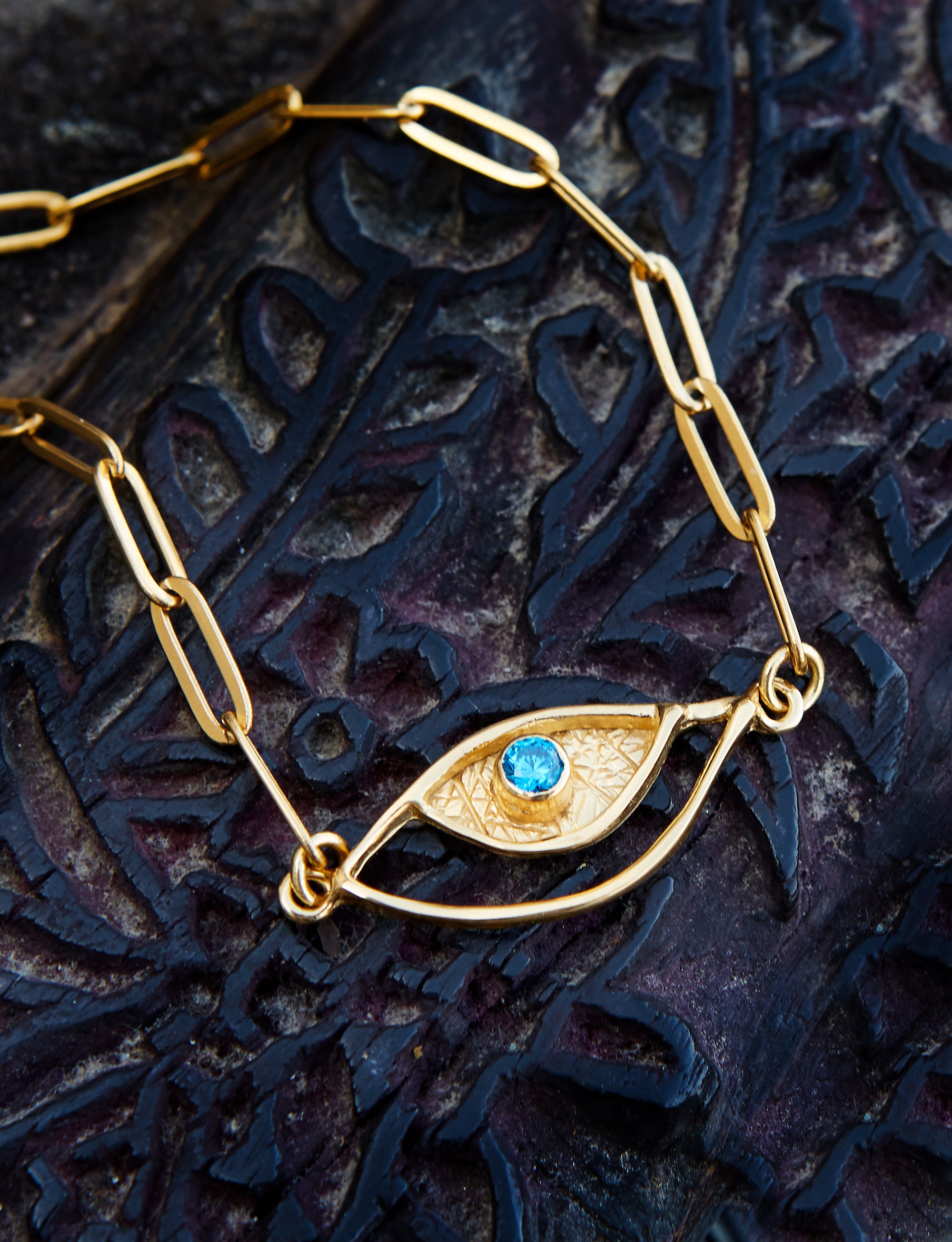 evil eye bracelet gold with blue gemstone