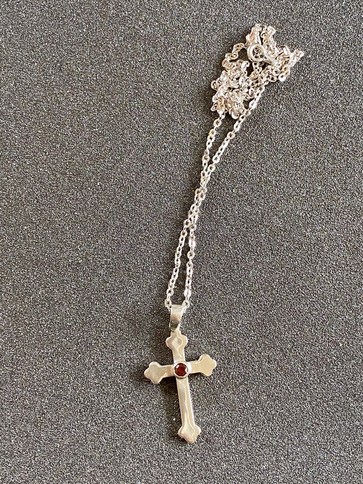  silver cross with garnet gemstone