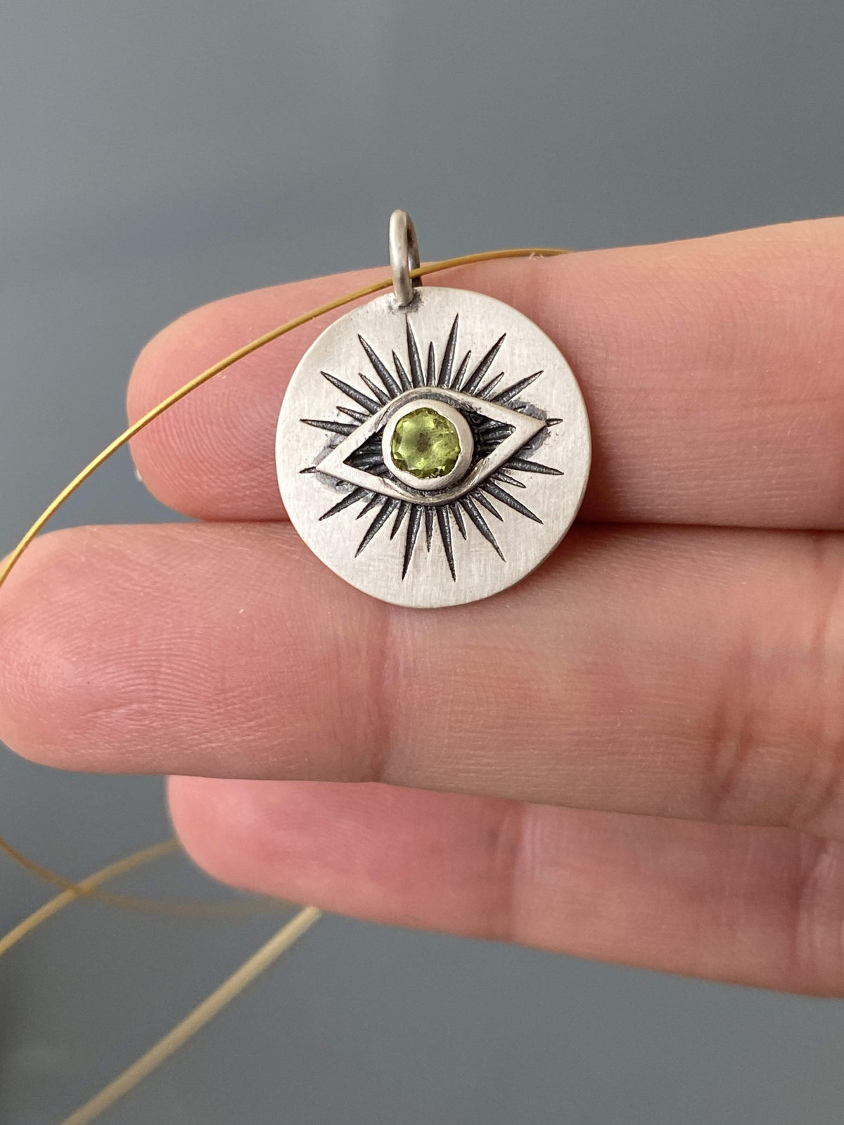 Evil eye necklace silver with a green gemstone 