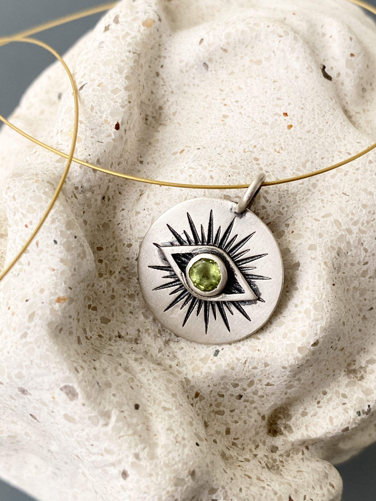 Evil eye necklace silver with a green gemstone 