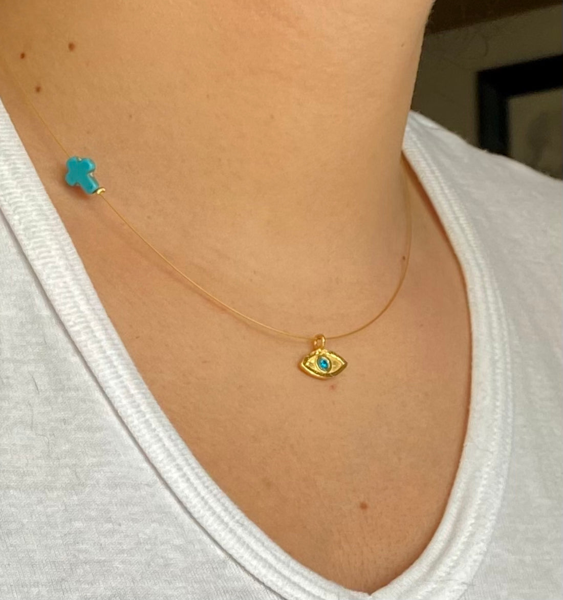 evil eye necklace gold with blue gem