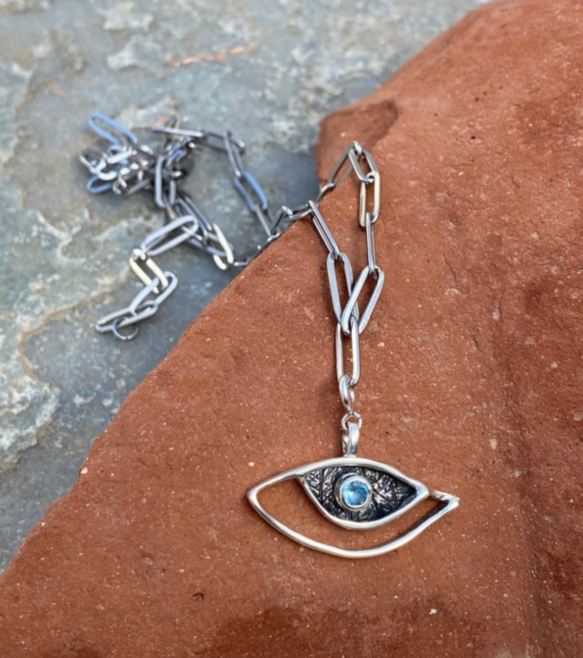 evil eye necklace with a paperclip chain