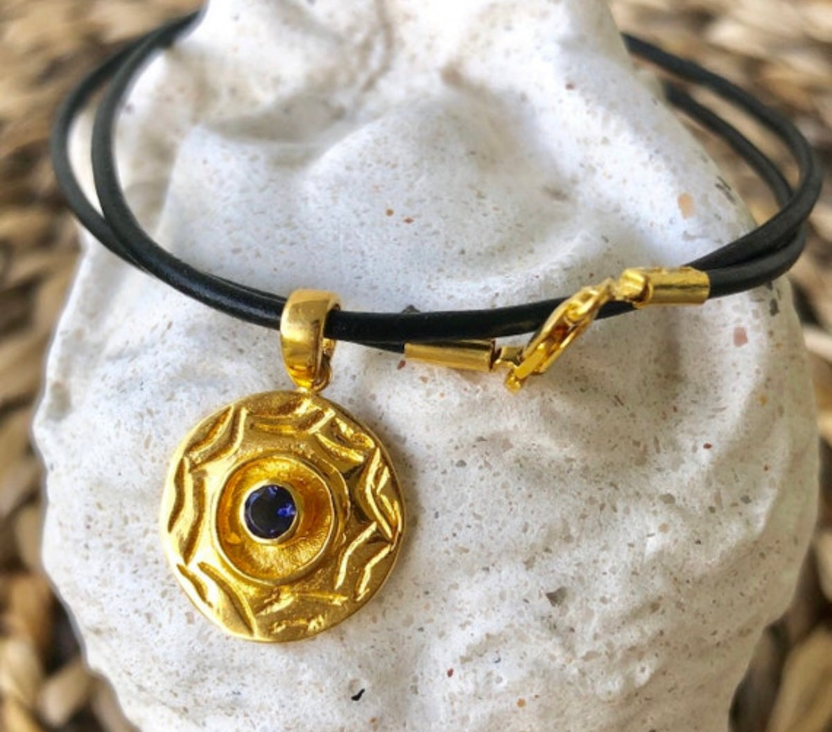 gold evil eye necklace with iolite gemstone