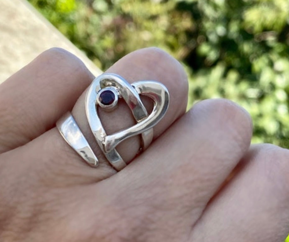 heart ring silver with a red garnet gemstone