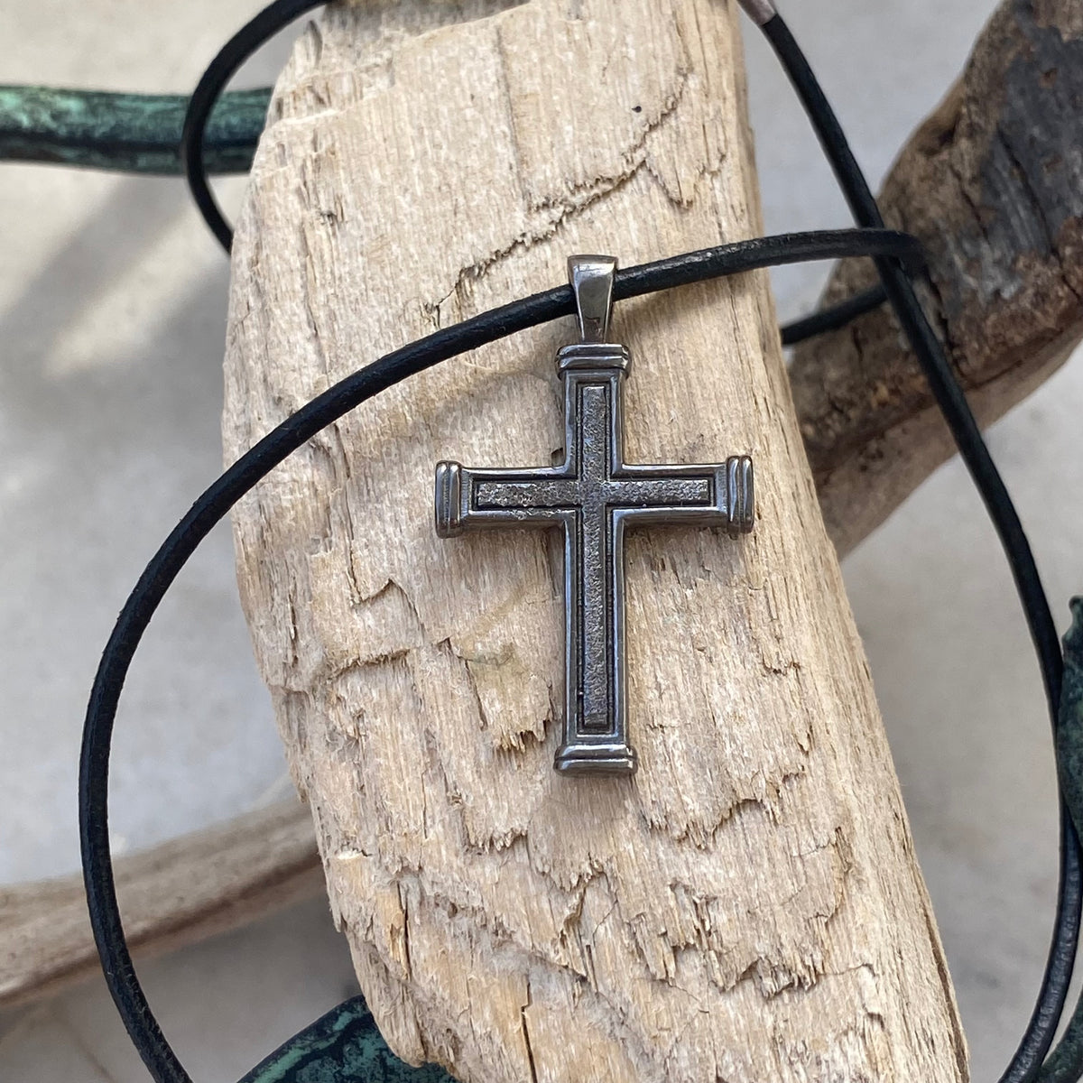 Men&#39;s black cross necklace with leather cord