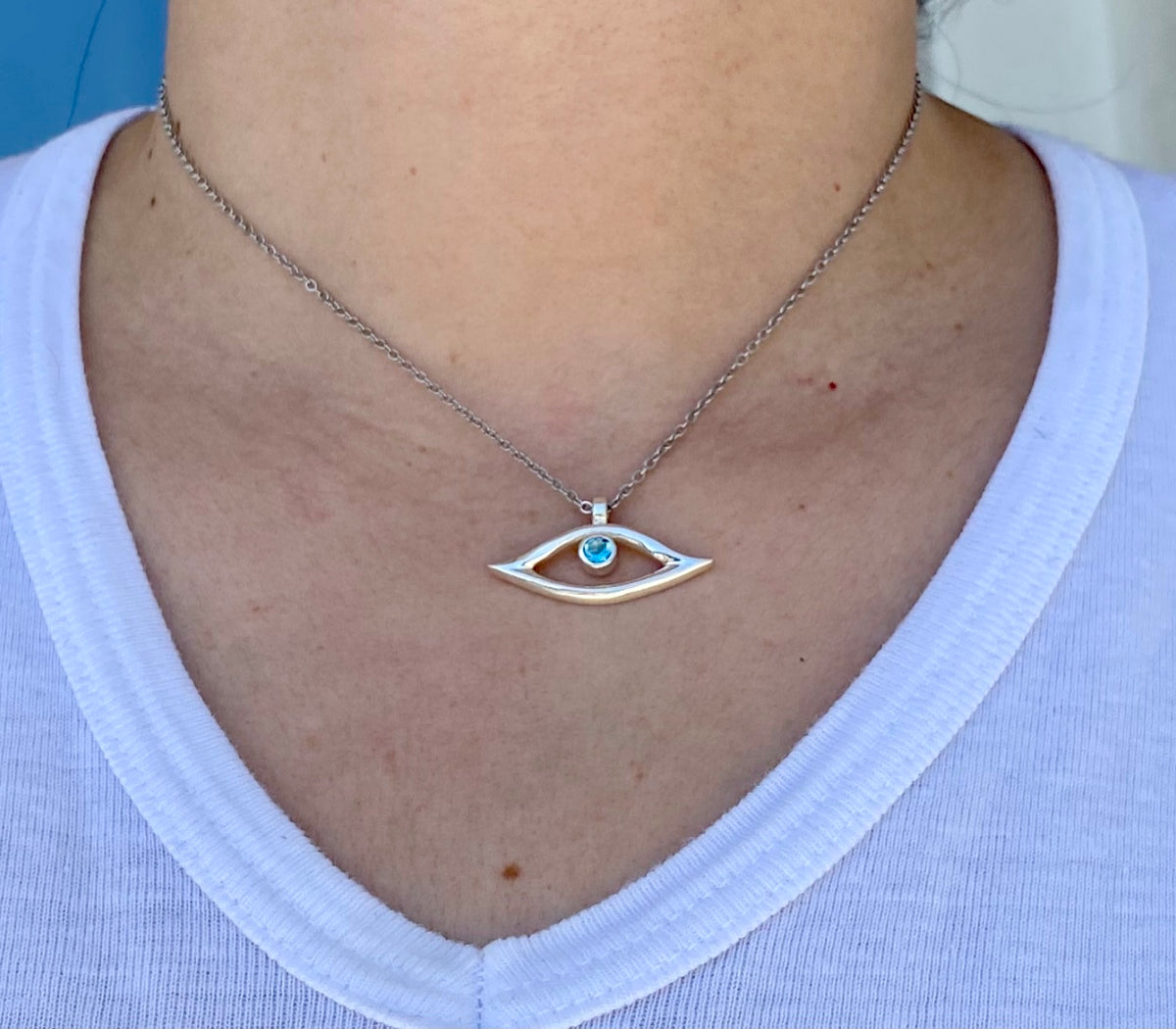 evil eye necklace with blue topaz gemstone