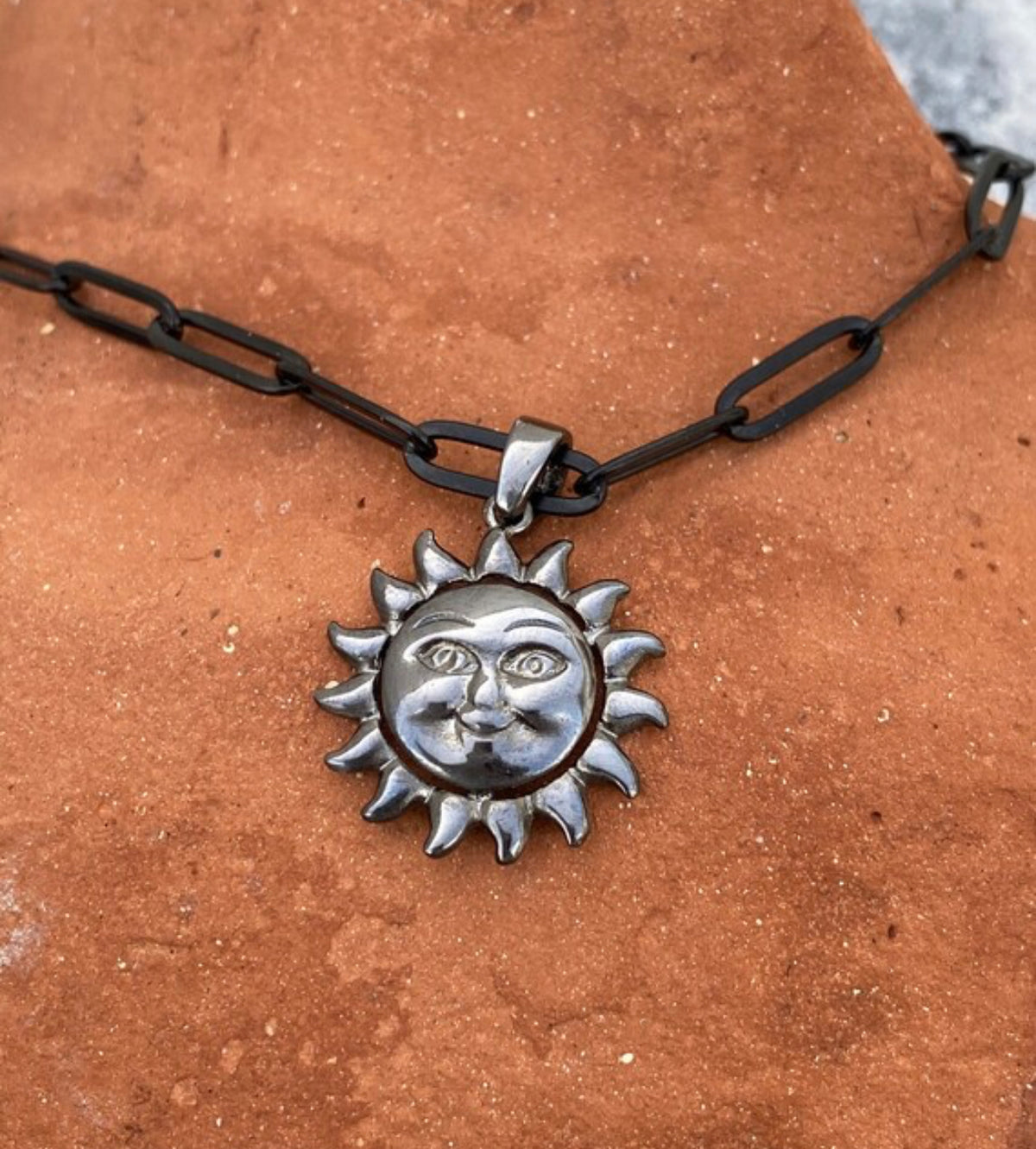 black sun necklace silver smiling sun with paperclip chain