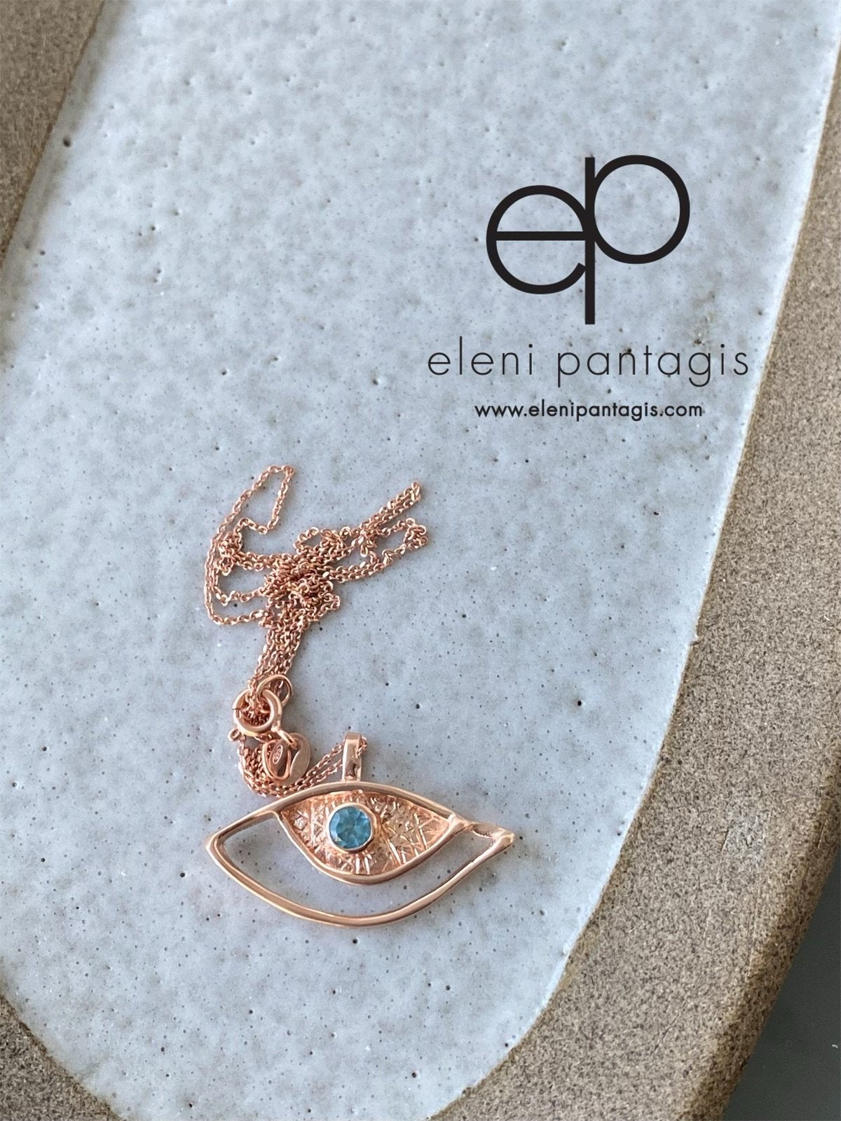 rose gold evil eye necklace with blue gemstone handmade