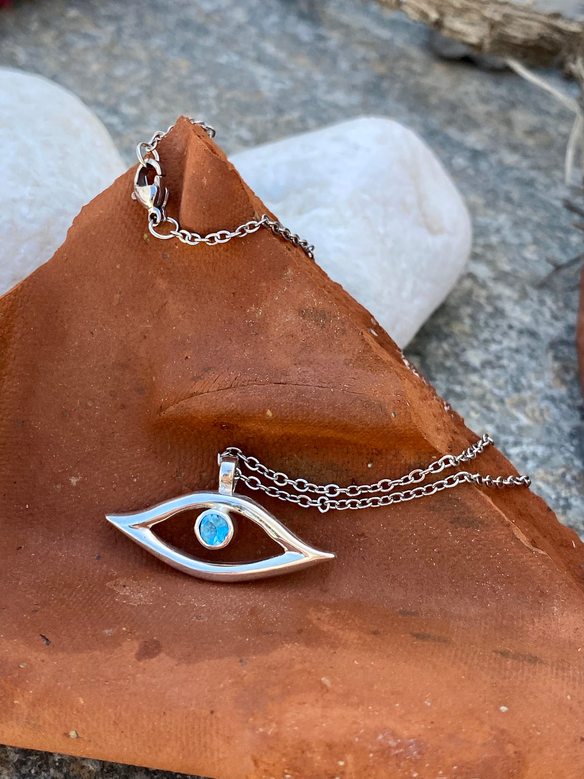evil eye necklace with blue topaz gemstone