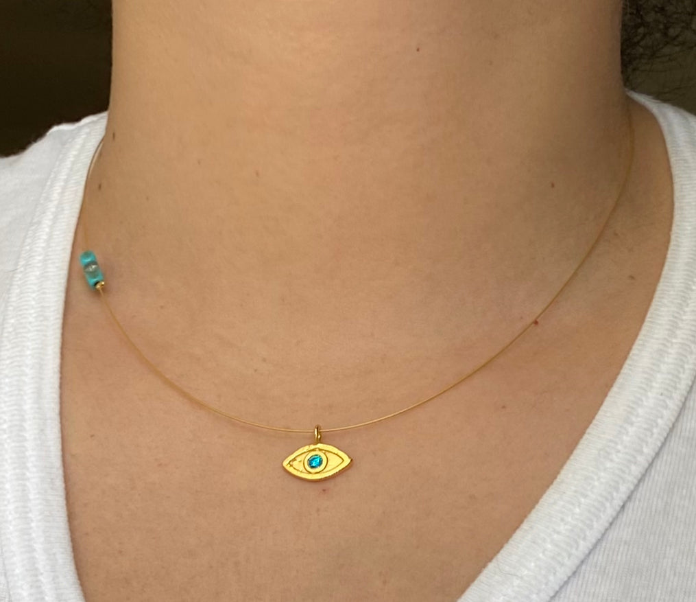 evil eye necklace gold with blue gem