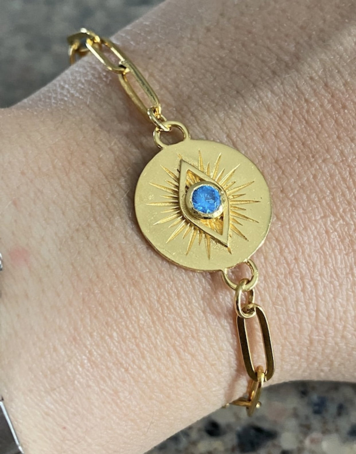 Evil eye bracelet gold with blue gem paperclip chain