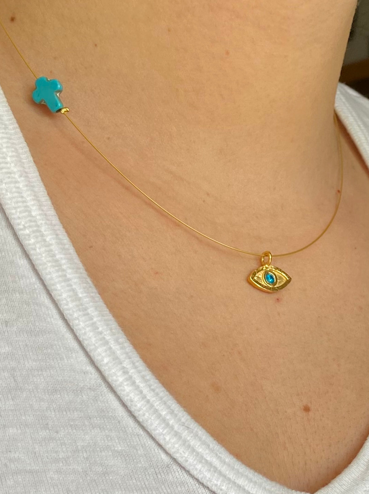 evil eye necklace gold with blue gem