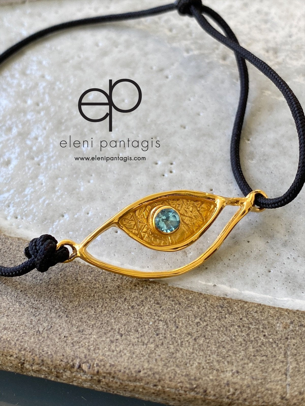 Evil eye bracelet gold, blue topaz gemstone black nylon cord 