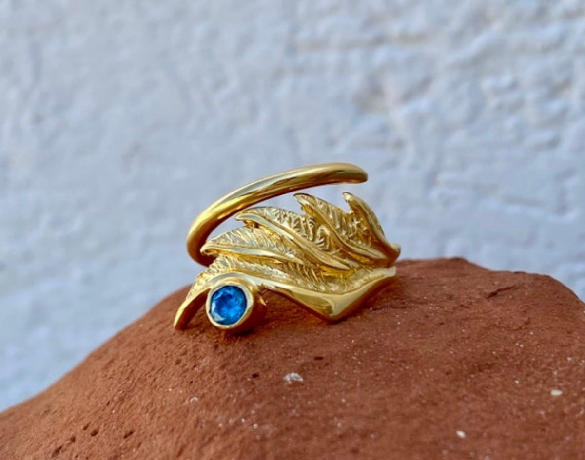 angel wing ring with blue gemstone