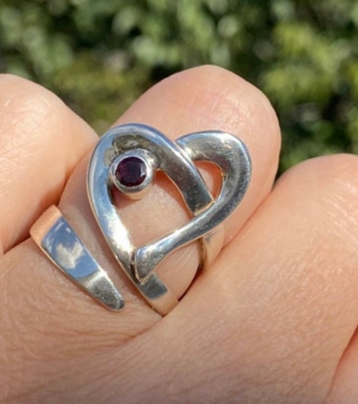 heart ring silver with a red garnet gemstone