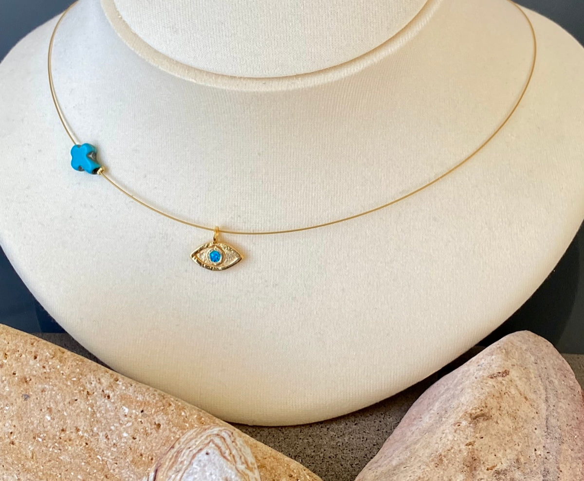 evil eye necklace gold with blue gem