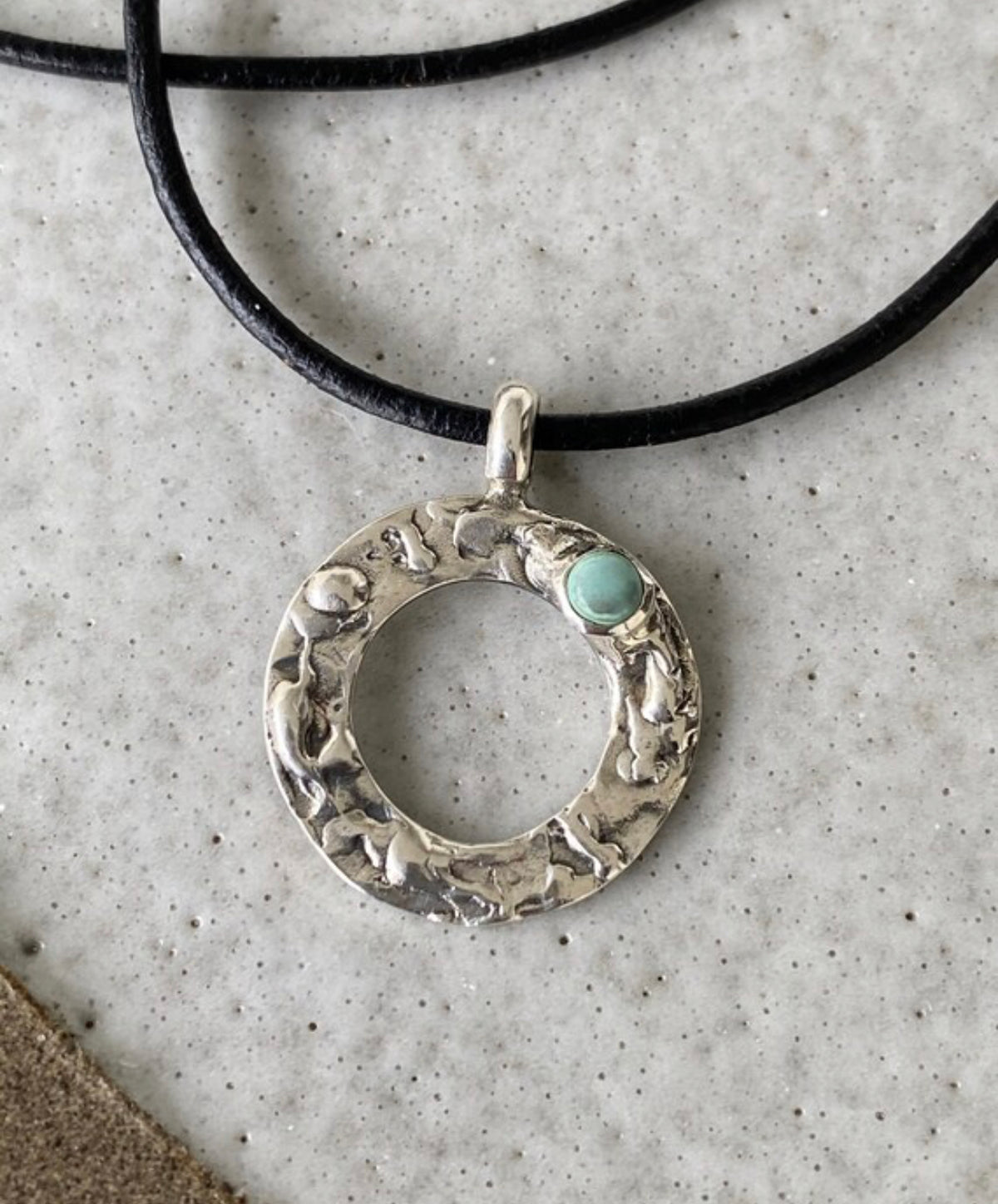 handmade circle necklace with a turquoise gemstone
