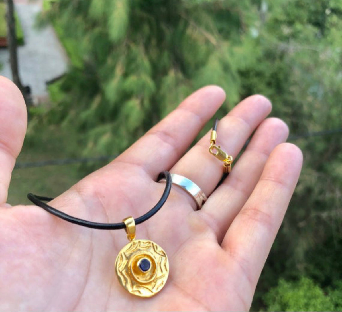 gold evil eye necklace with iolite gemstone
