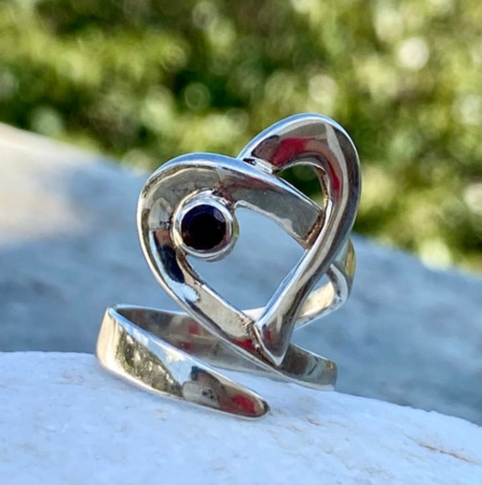 heart ring silver with a red garnet gemstone