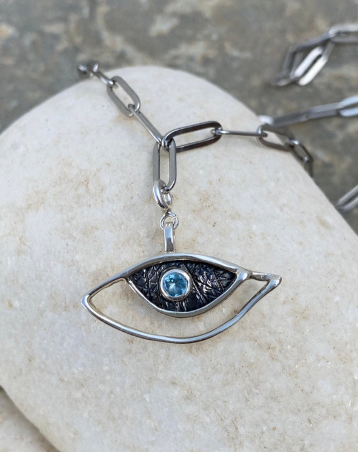 evil eye necklace with a paperclip chain