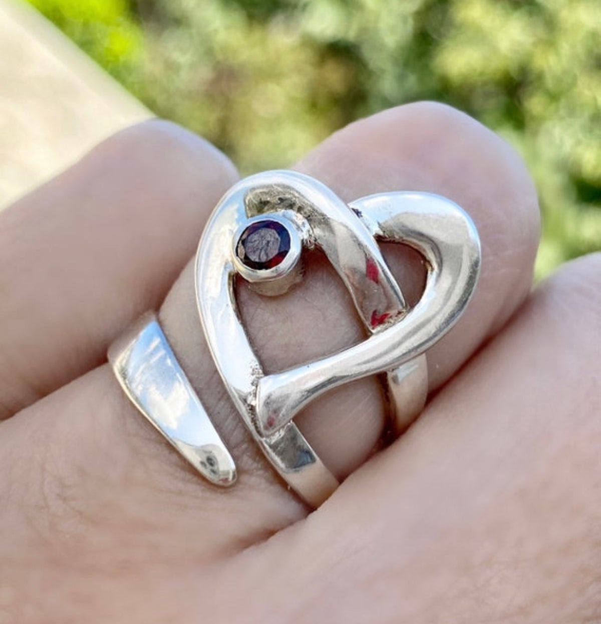 heart ring silver with a red garnet gemstone