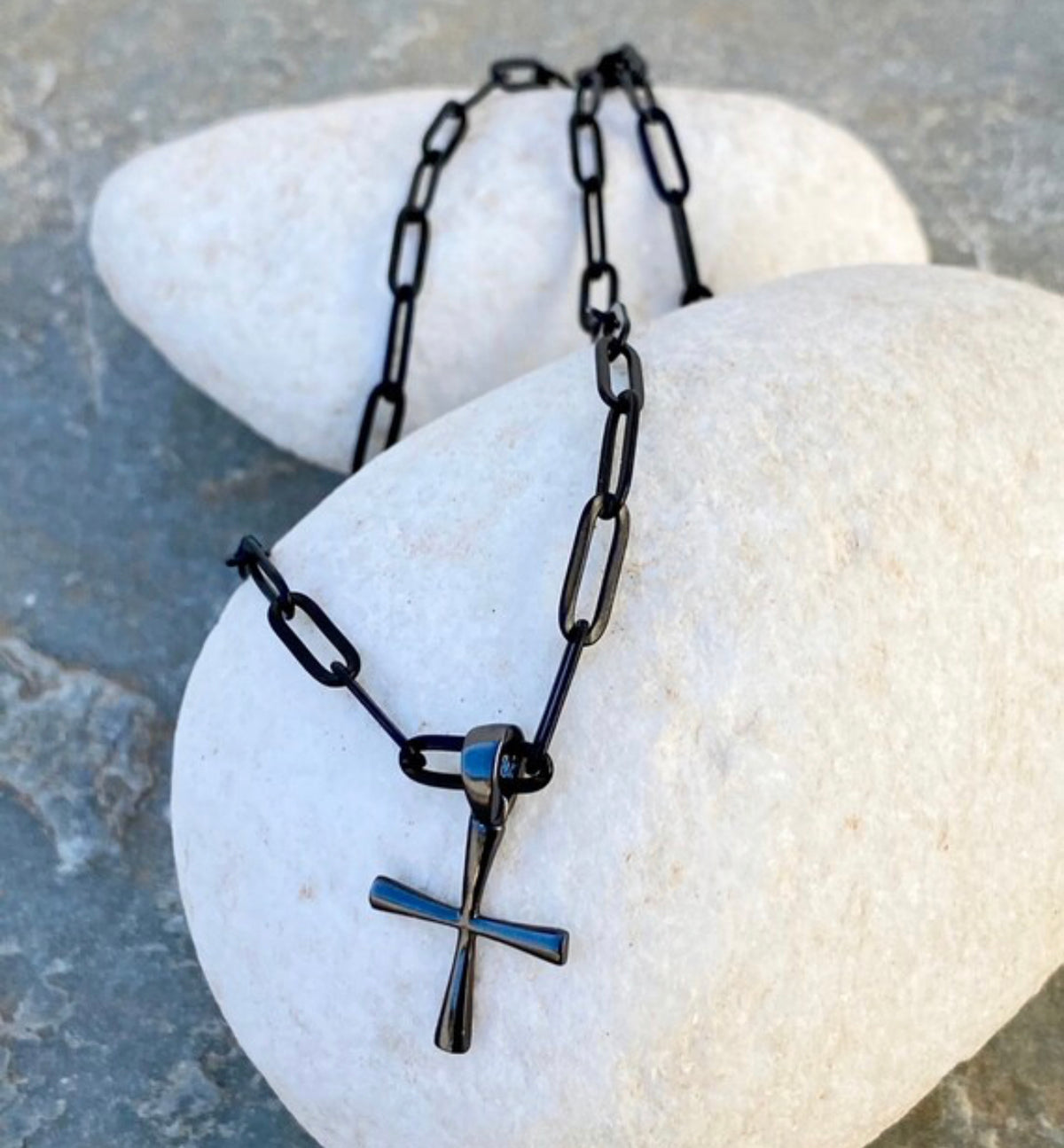 black cross with black paper clip chain