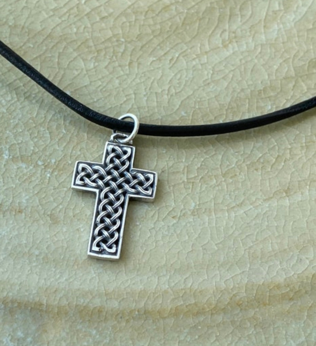 silver Celtic cross with black leather cord
