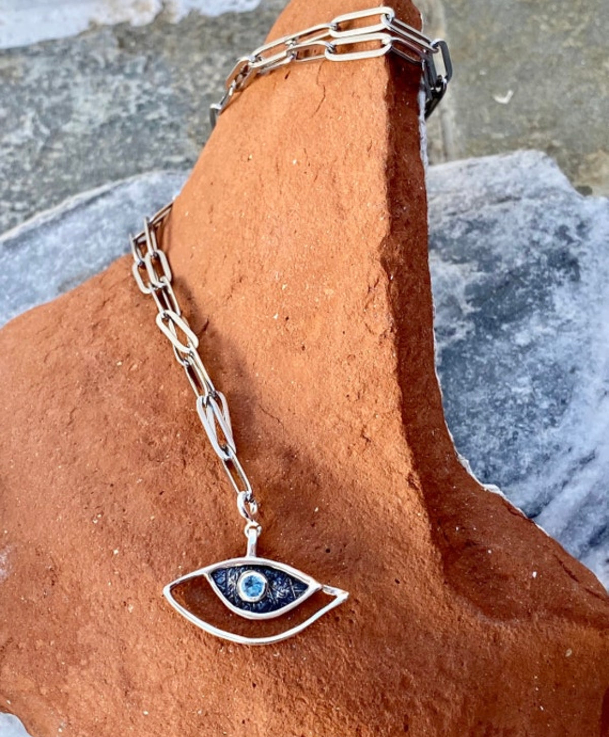 evil eye necklace with a paperclip chain