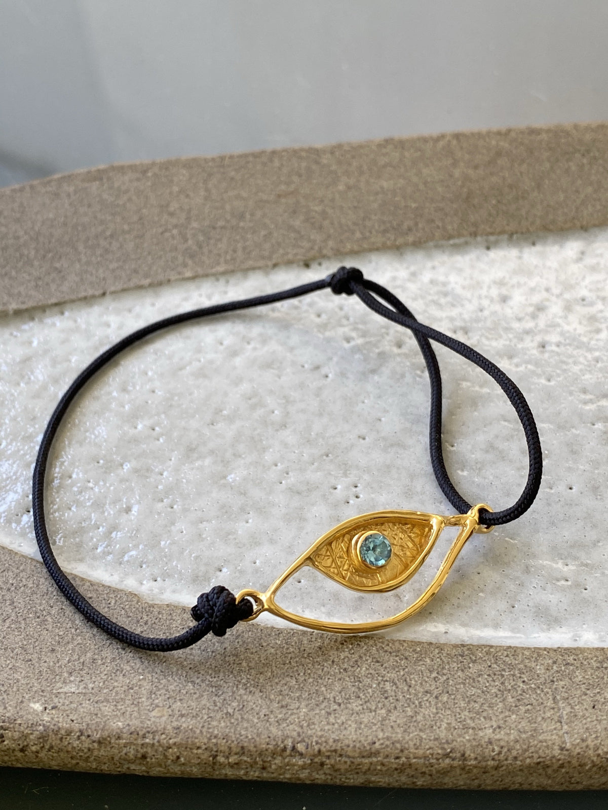 Evil eye bracelet gold, blue topaz gemstone black nylon cord 