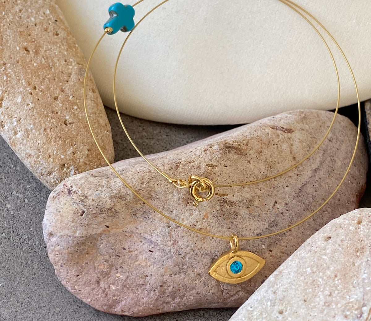 evil eye necklace gold with blue gem