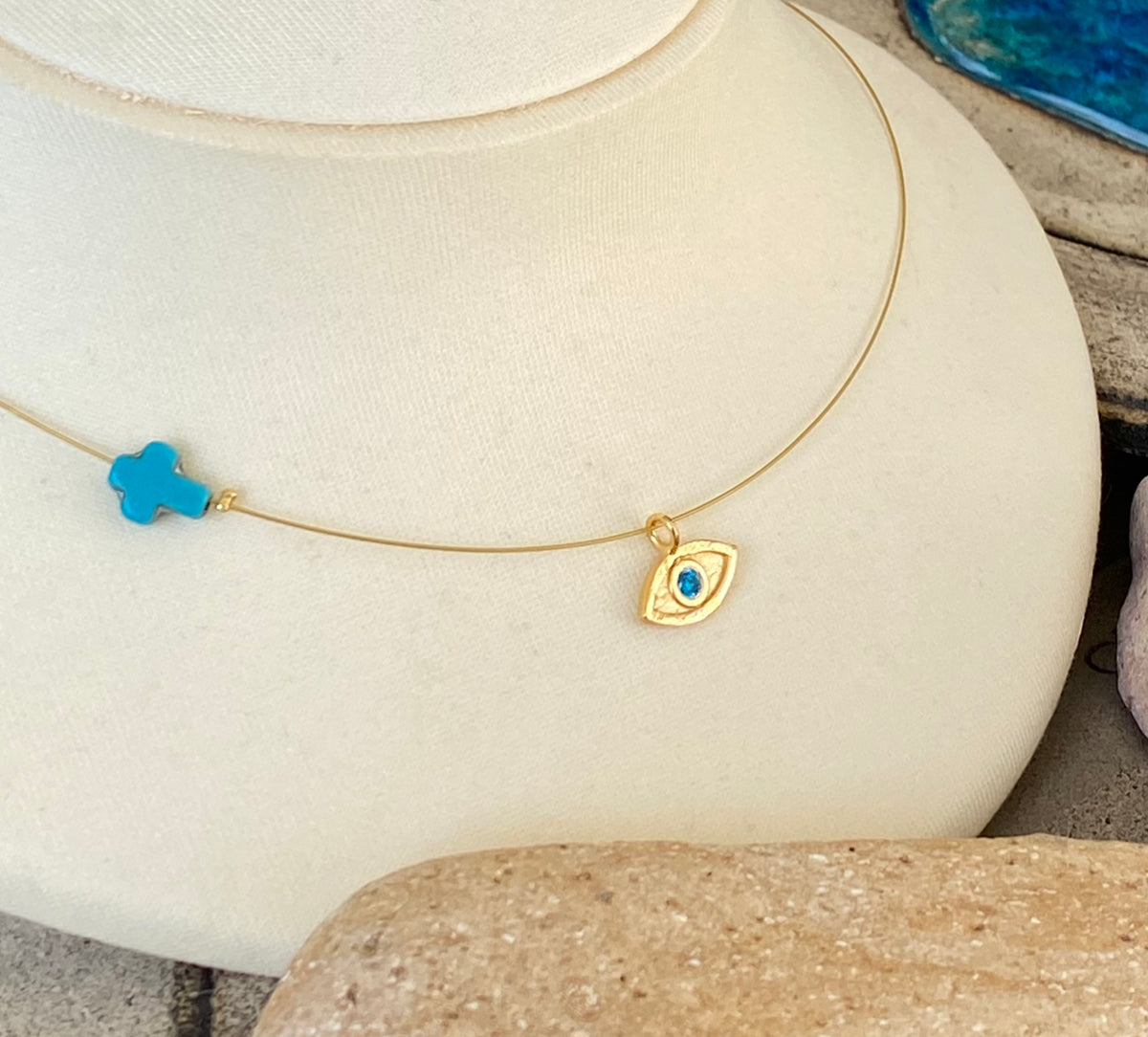 evil eye necklace gold with blue gem