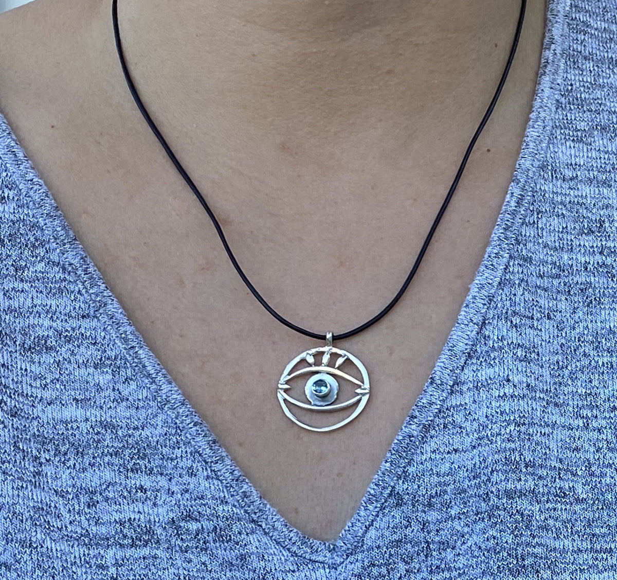 Evil eye necklace with blue gemstone and leather cord