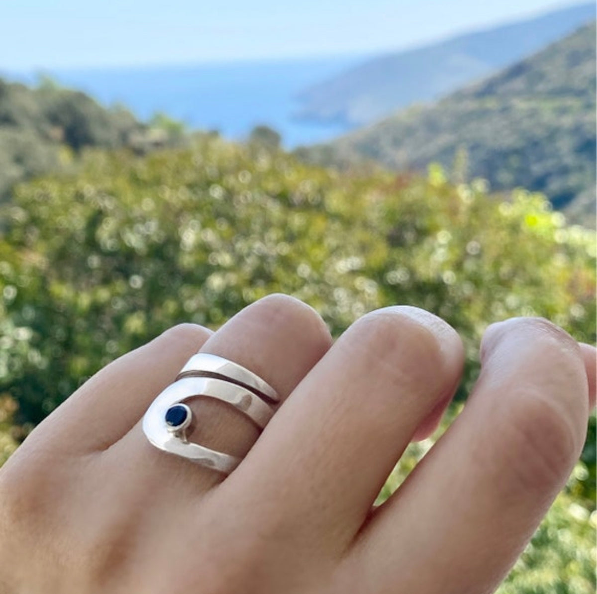 silver ring with black gemstone