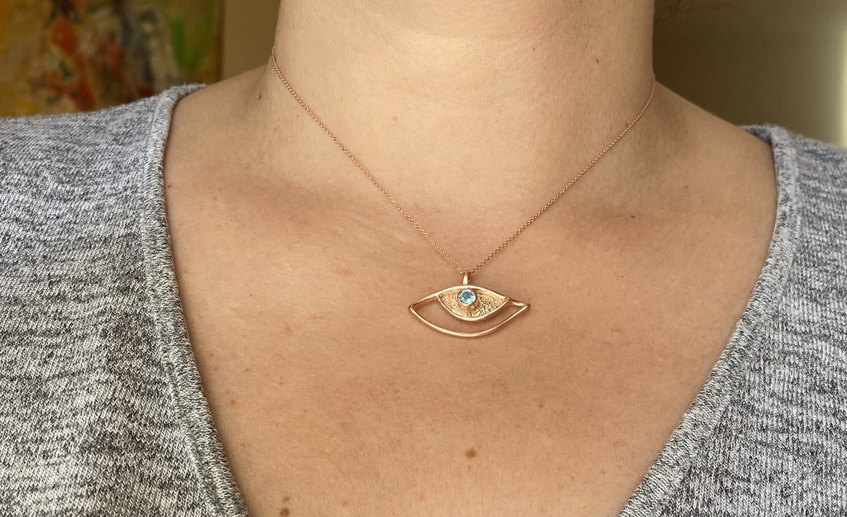 rose gold evil eye necklace with blue gemstone handmade