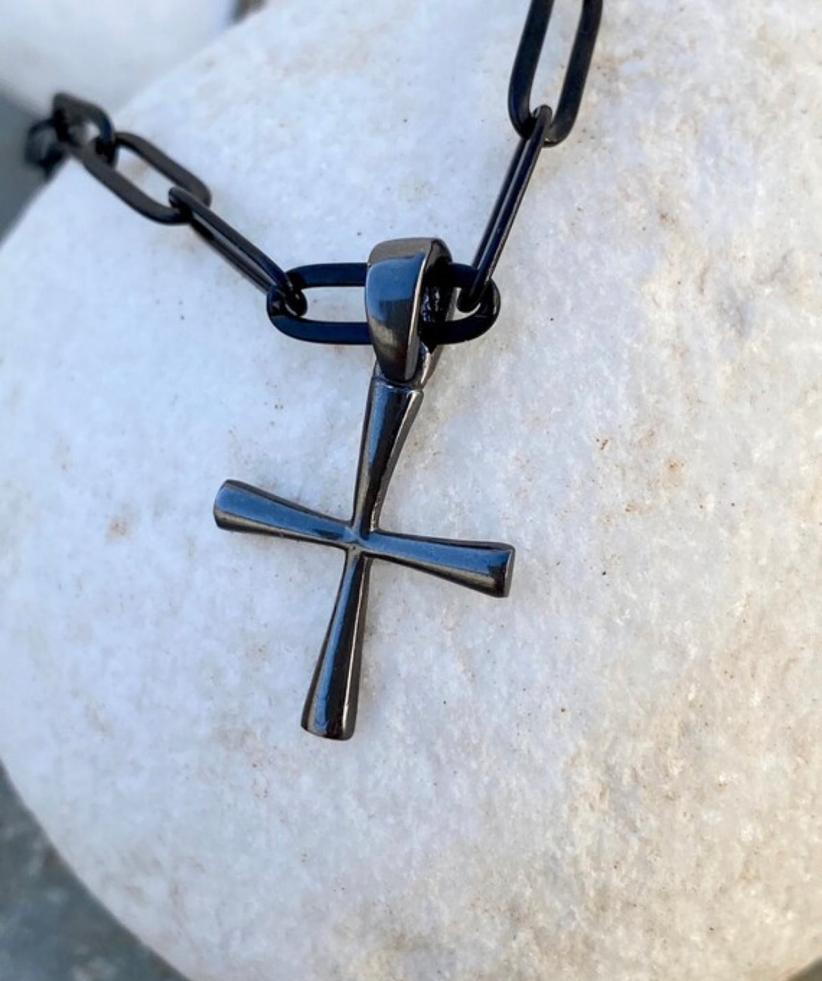 black cross with black paper clip chain