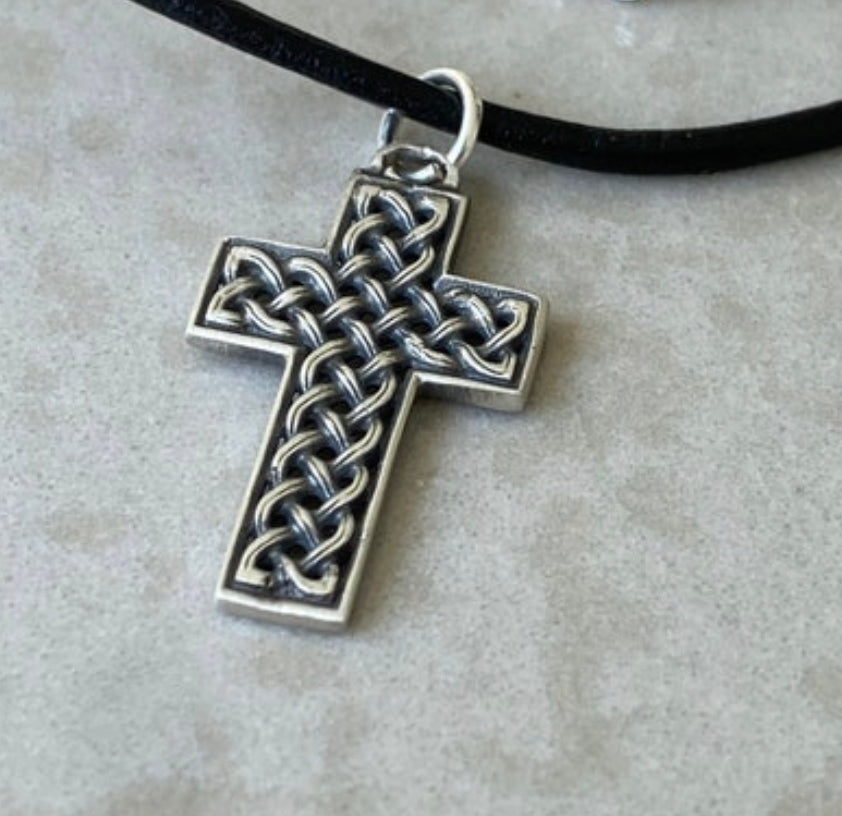 silver Celtic cross with black leather cord