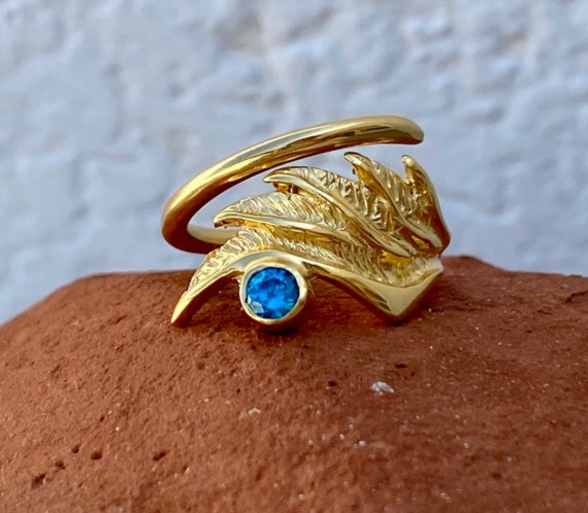 angel wing ring with blue gemstone