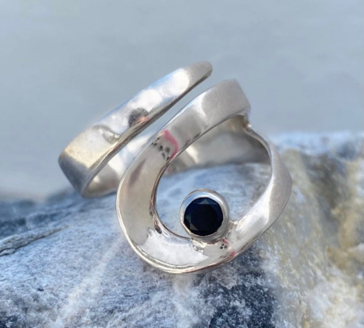 silver ring with black gemstone