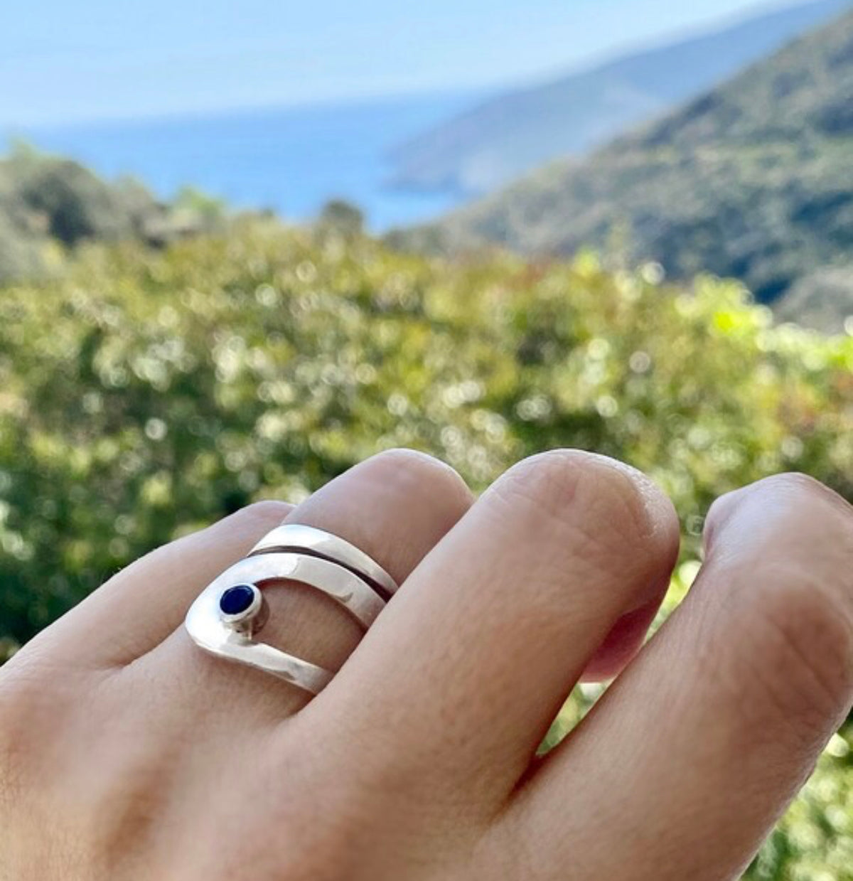 silver ring with black gemstone